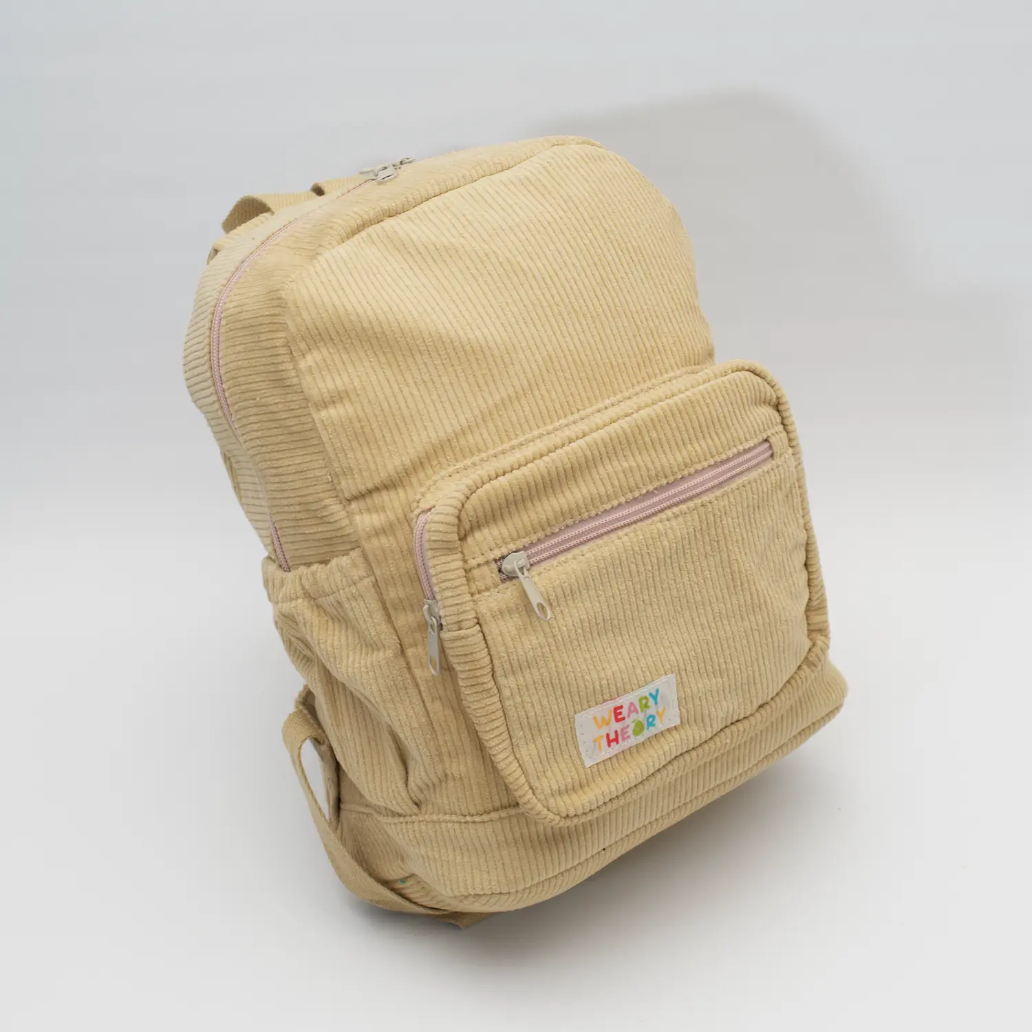 Side angle view of Oat Corduroy Backpack